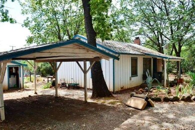 5227 has a small carport, shed and laundry buildin