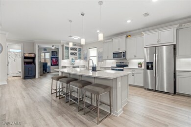 Kitchen featuring crown molding, a kitchen breakfa