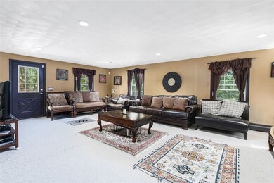 Spacious living room with access to the back deck