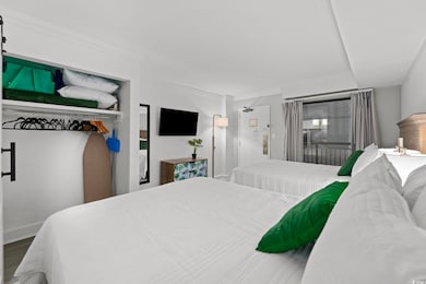 Bedroom with hardwood / wood-style floors