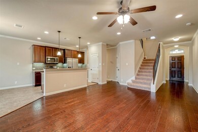 Unfurnished living room featuring crown molding, 