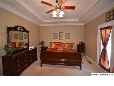 Spacious Master Bedroom with french doors opening 