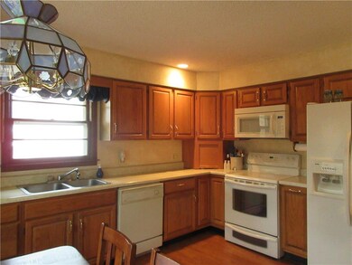 Another view of kitchen showing appliances, etc.