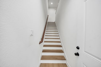 Precision-crafted stairs lead up seamlessly into t