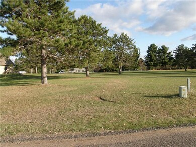 View from Spring Green Lane toward lot. Closest neighbor's house is just visible on the left.