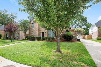 Long driveway leads to a detached 2-car garage with automatic garage door opener.