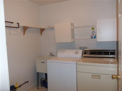Spacious utlitly/laundry room includes washer and 