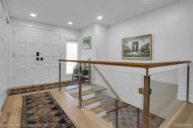 Entryway featuring light wood finished floors and recessed lighting