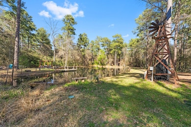 This serene property features a private pond surro