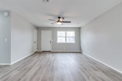 Empty room with light hardwood / wood-style floori