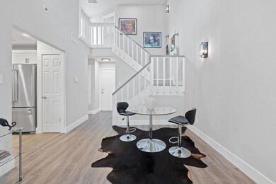 Foyer featuring visible vents, baseboards, light 
