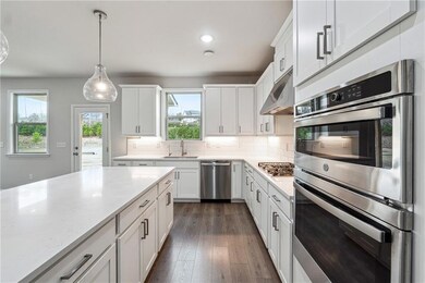 Kitchen with decorative backsplash, dark wood-styl