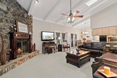 Family Room with beautiful stone fireplace , Vault