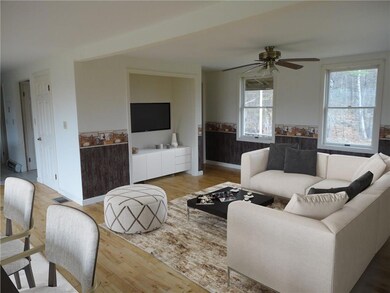 LIVING ROOM LOOKING TO THE...