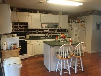 Kitchen with island and eating area