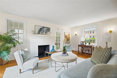 Living area with wood finished floors, a fireplace