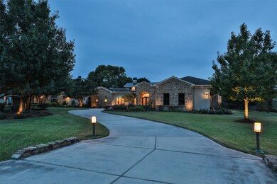 Beautifully landscaped acre lot with a winding driveway