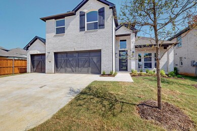 View of front of house featuring a garage and a fr