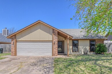 View of front of home with brick siding, an attach