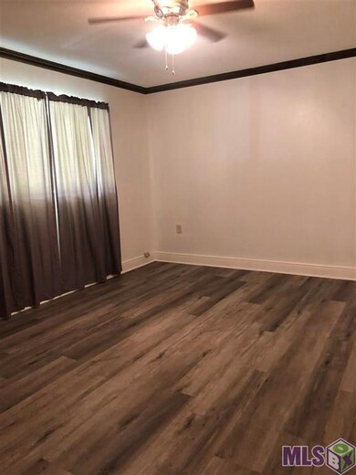 This is the room off of the front door, vinyl floo