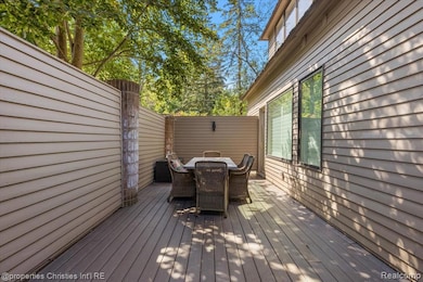 Wooden deck featuring outdoor dining area