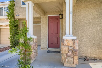 View of exterior entry with stucco siding