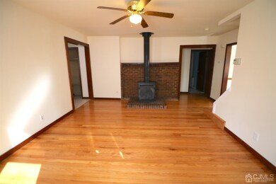 Wood burning stove with brick hearth in Living Roo