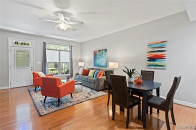 Wood floored dining space featuring ceiling fan