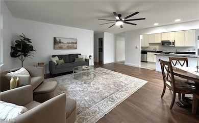 Open floor plan to completely remodeled Kitchen with a Breakfast Bar.