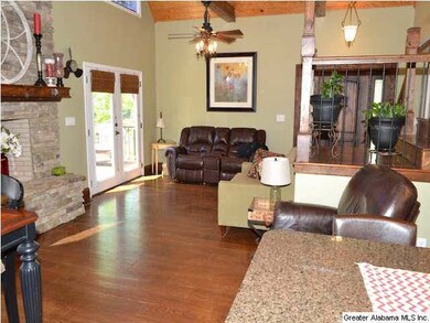 The living room also has great views of the lake, 