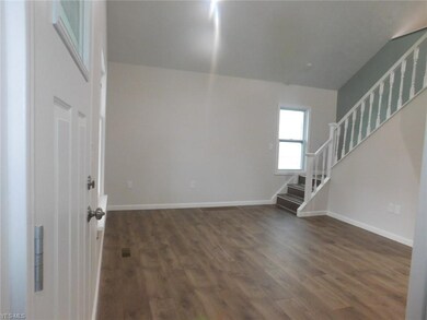 Living room with upgraded laminate flooring making
