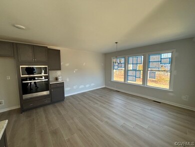 Kitchen with an inviting chandelier, pendant light