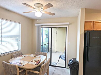 Eat in kitchen area, with sliding doors to front e