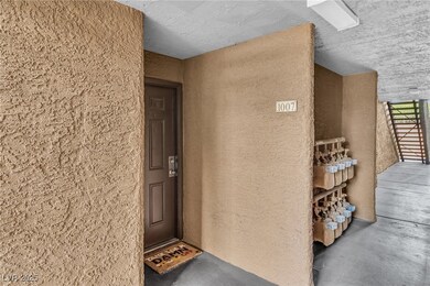Doorway to property featuring stucco siding