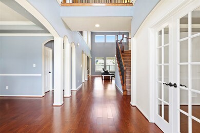 As you enter you notice the beautiful hard wood flooring throughout the entry, office, dining and living area. There is a formal dining room to the left and a nice sized office to the right.