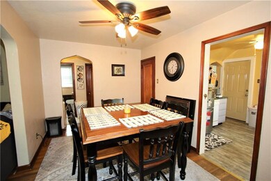 The 13x9 Dining Room connects to the side hall as 