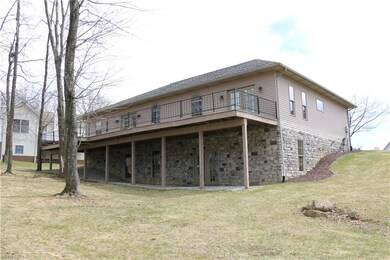 rear view of house and walk-out basement