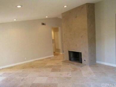 Large living room area with recessed lighting, tel