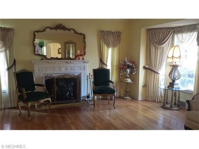 Gorgeous plaster work mantel and bow window in liv