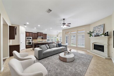 Relax by the fireplace in the living room with you