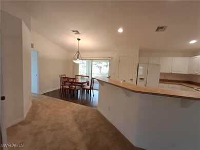 Kitchen with white fridge with ice dispenser, carp
