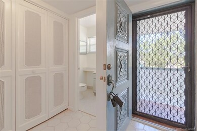 Beautiful screen door makes cross ventilation poss