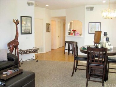 Wood laminate flooring in halls and breakfast bar 