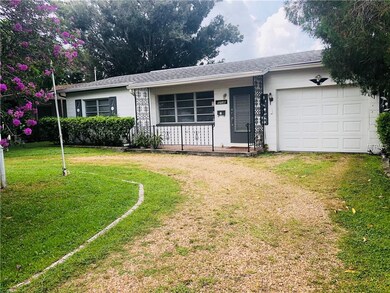 Front of Home with circular driveway.