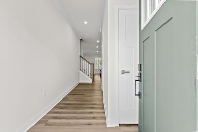 Hallway with wood-type flooring