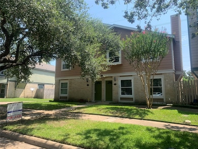 2 townhomes in front, side by side facing the park