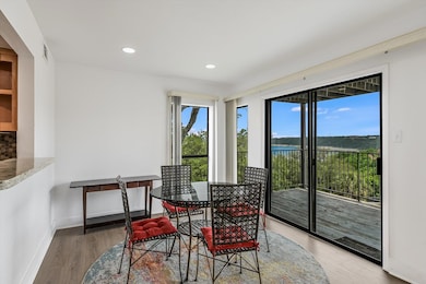 Dining room featuring light wood-style floors, ba