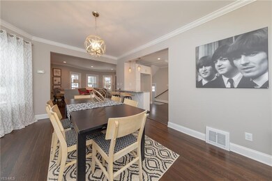 The Dining Room with hardwood floor and crown molding