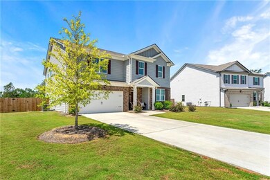 View of front of property featuring a garage and a