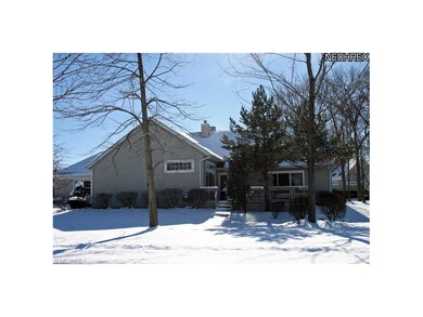 Side View showing the deck. Lovely treed lot.